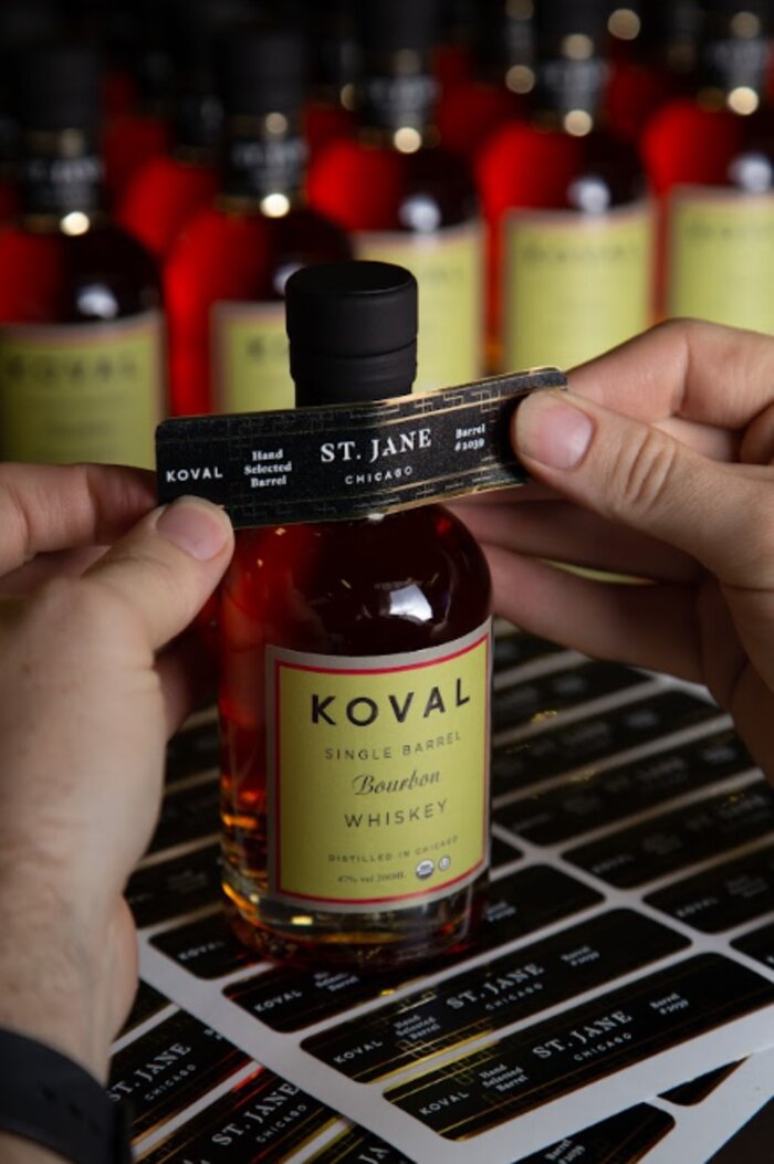 KOVAL custom-labeled whiskey bottle