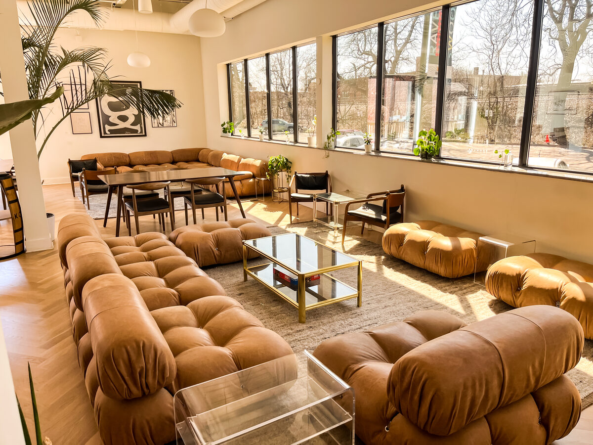 KOVAL Distillery tasting and event room with leather seating and street-facing windows