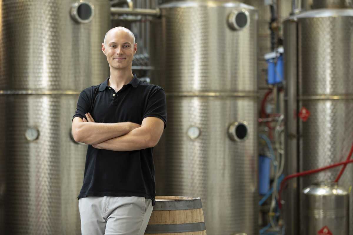 Dr. Robert Birnecker in front of the still