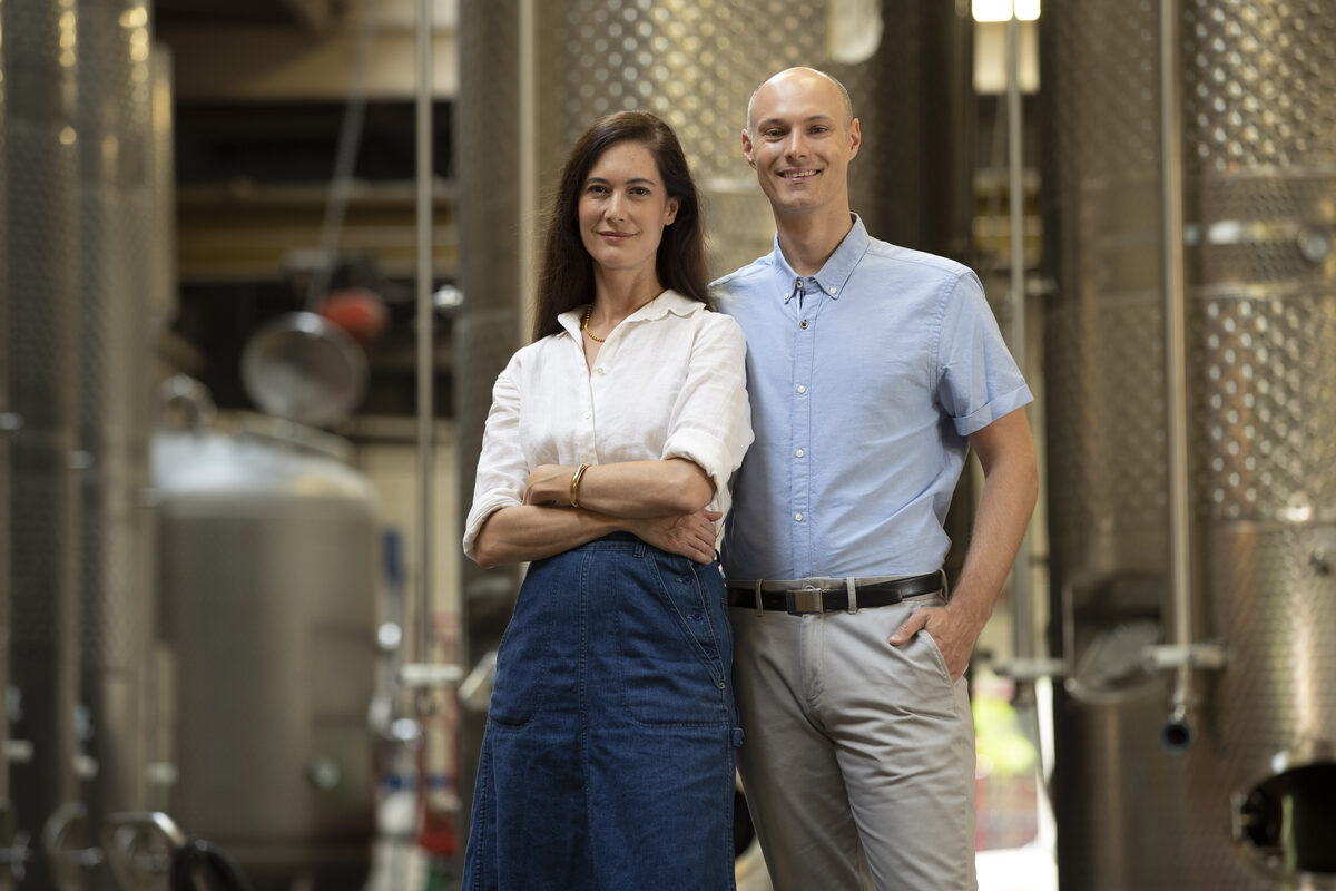 Dr. Sonat Birnecker Hart and Dr. Robert Birnecker with fermenters and mashtank